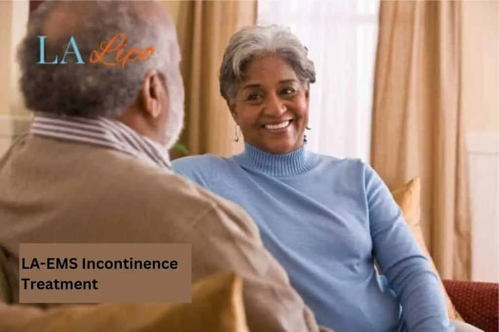 Couple sat smiling at each other - LA-EMS treatment Dunstable
