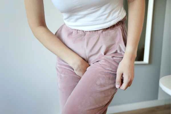 woman running for the toilet because of urinary incontinence Dunstable